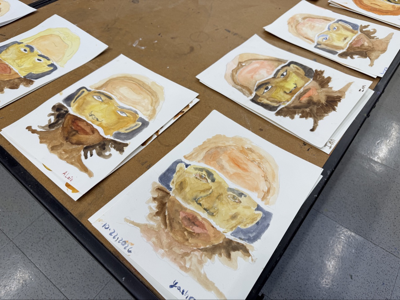 Skin tone studies painted by middle school students in my class. Each portrait practices light, medium, and dark skin in a single face.