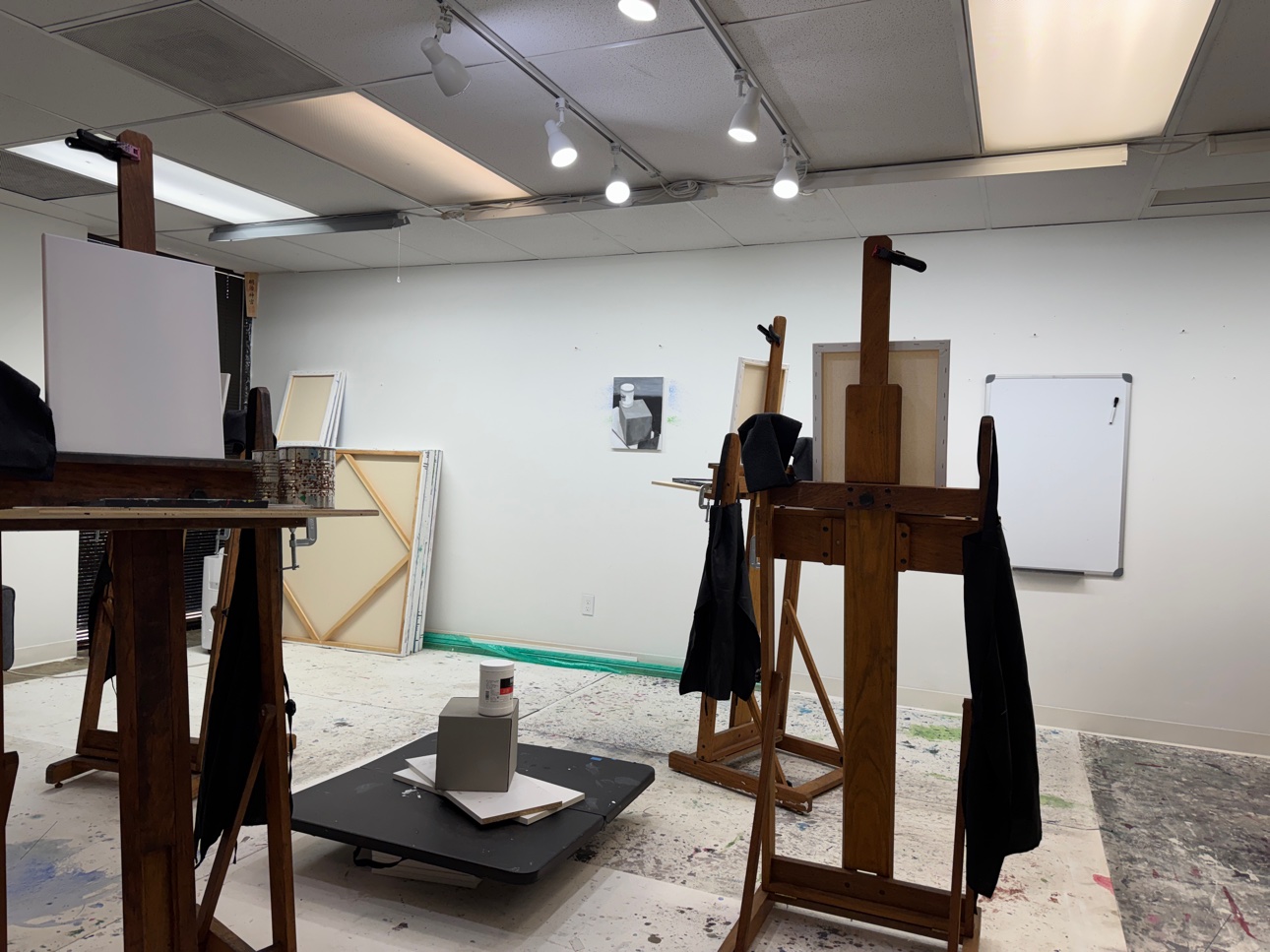 The studio set up for an evening class, easels and materials ready before students arrive.